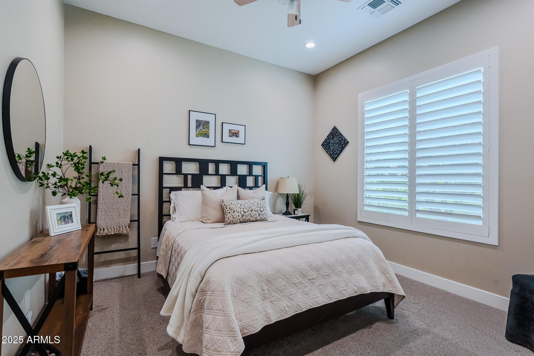 2049 East Gaffney Road New River, AZ 85087 - Photo 33 of 77 a bedroom with a large bed and a window