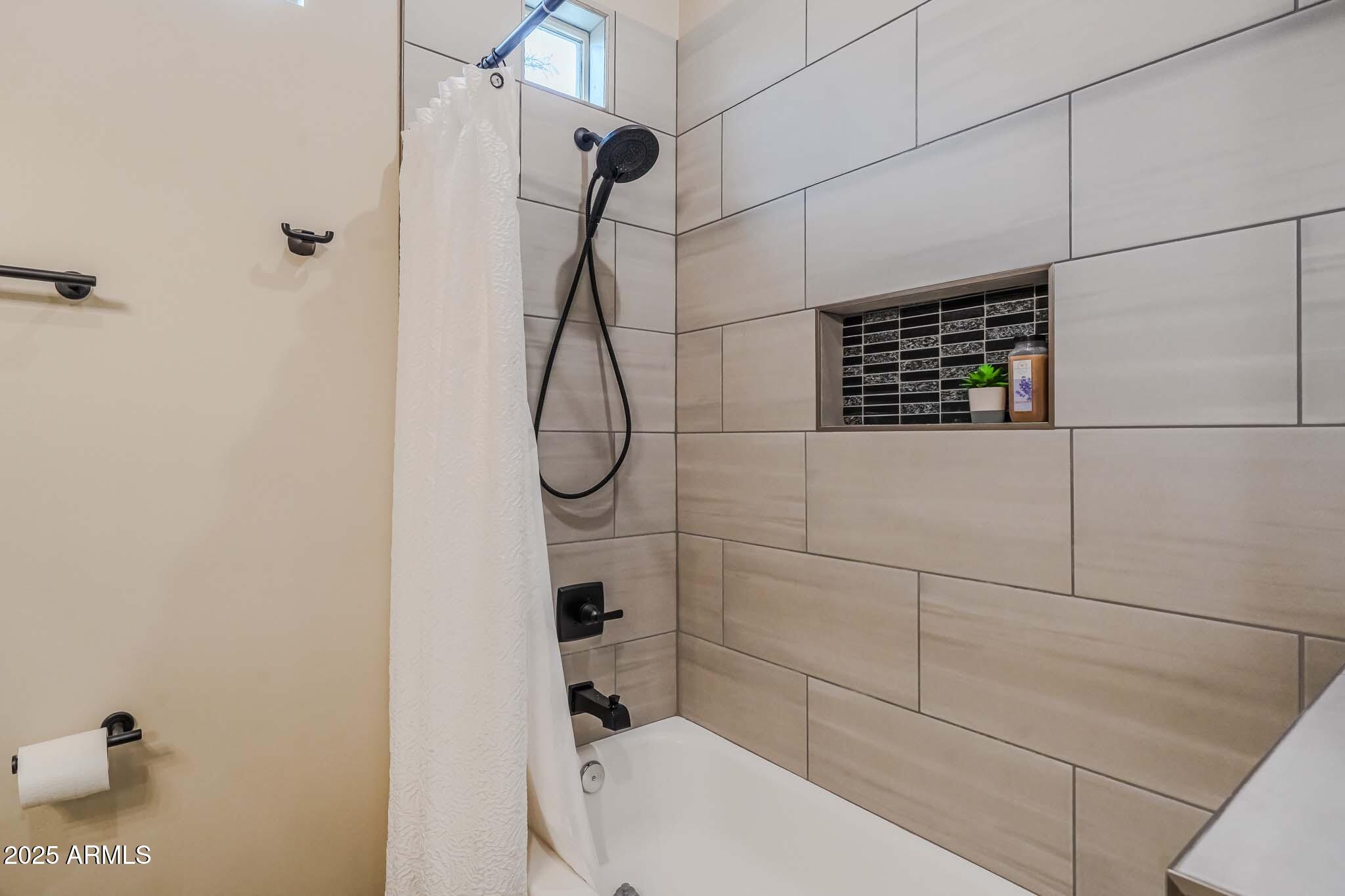 2049 East Gaffney Road New River, AZ 85087 - Photo 36 of 77 a bathroom with a shower a toilet and a shower