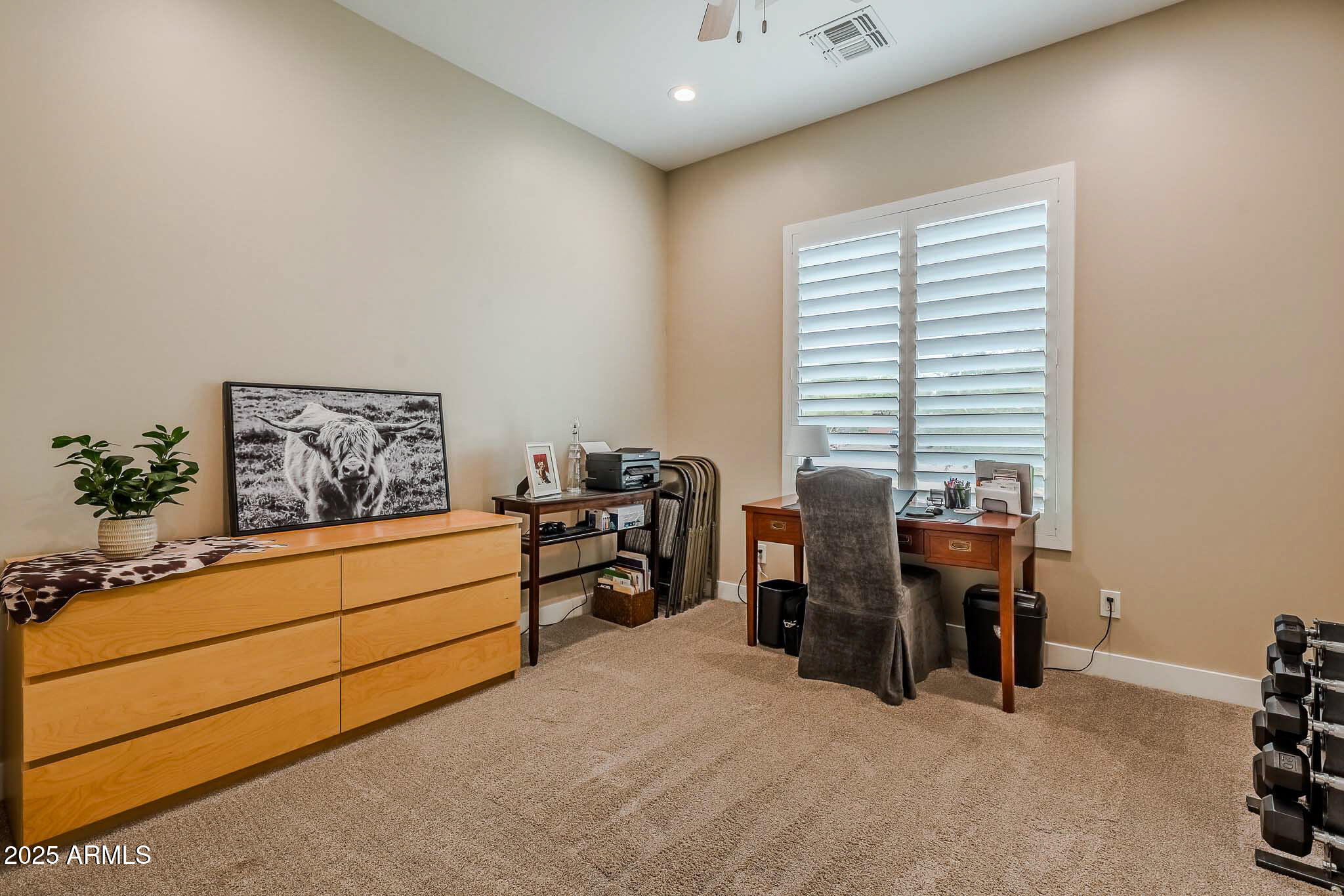2049 East Gaffney Road New River, AZ 85087 - Photo 37 of 77 a view of a workspace with furniture and a window
