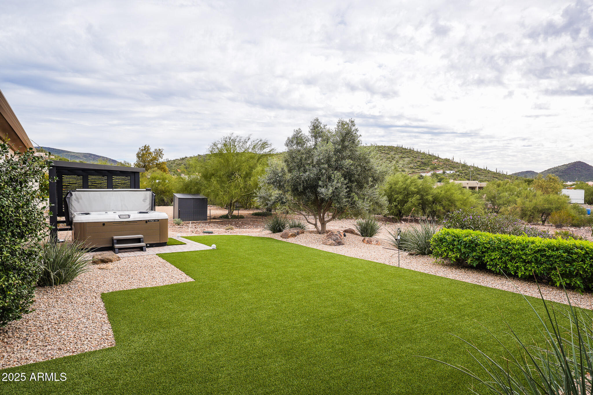 2049 East Gaffney Road New River, AZ 85087 - Photo 52 of 77 a view of a swimming pool with a patio