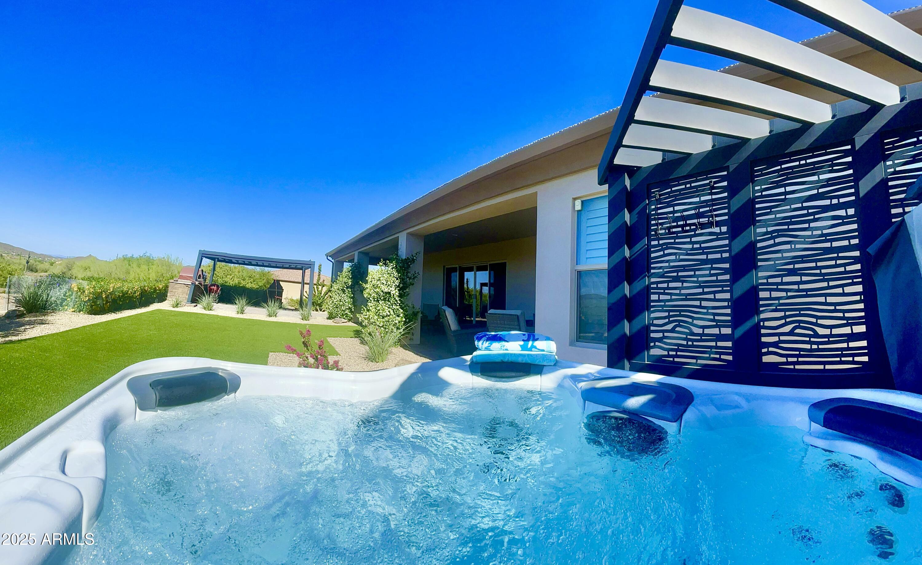 2049 East Gaffney Road New River, AZ 85087 - Photo 56 of 77 a view of a house with backyard porch and furniture