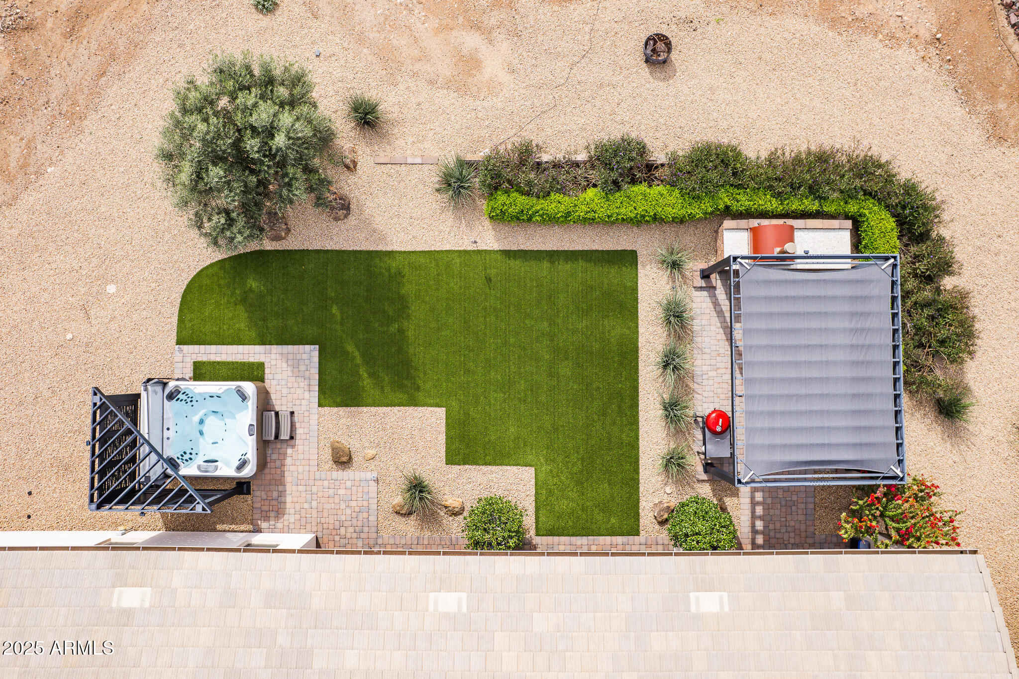 2049 East Gaffney Road New River, AZ 85087 - Photo 6 of 77 an aerial view of a house with a garden and fire pit