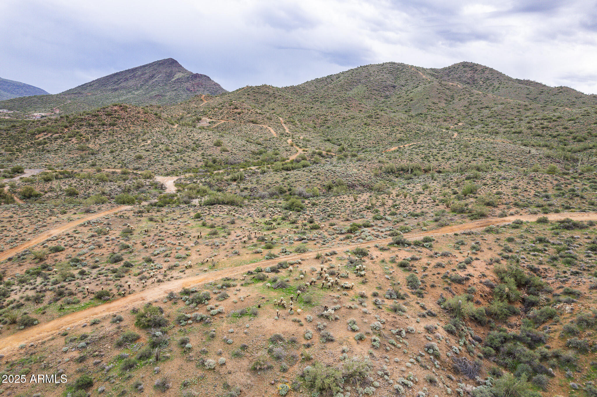 2049 East Gaffney Road New River, AZ 85087 - Photo 61 of 77 a view of a dry yard with mountains in the background