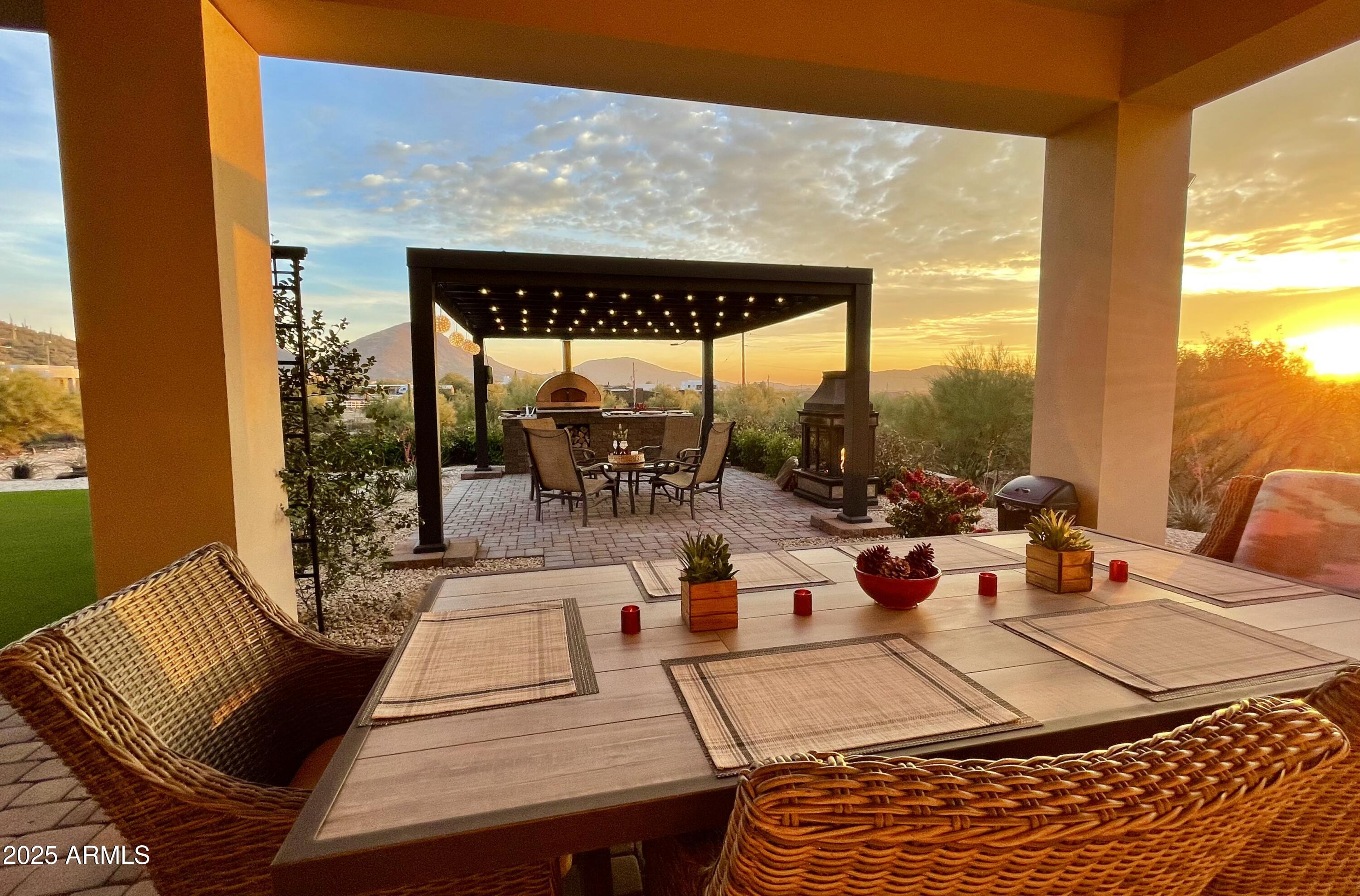 2049 East Gaffney Road New River, AZ 85087 - Photo 7 of 77 a view of a patio with dining table and chairs