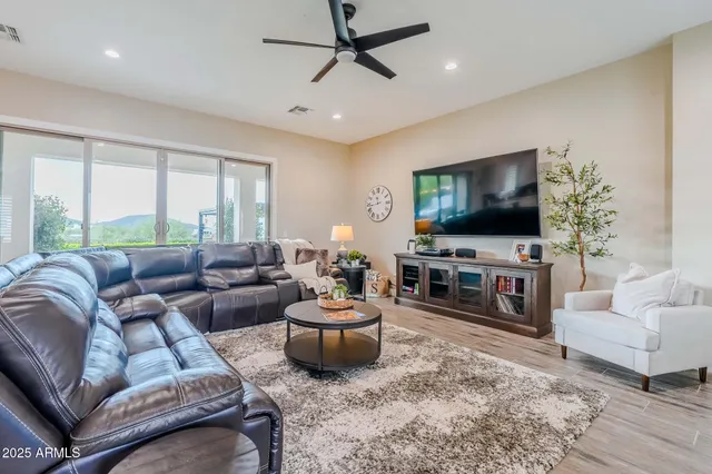 a kitchen with kitchen island a sink counter top space a sink and wooden floor