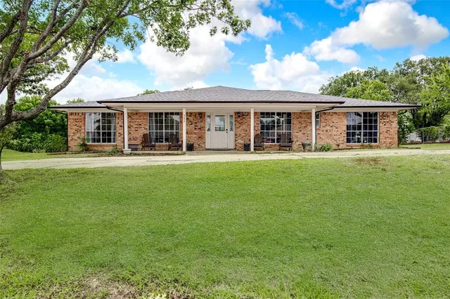 front view of a house with a yard