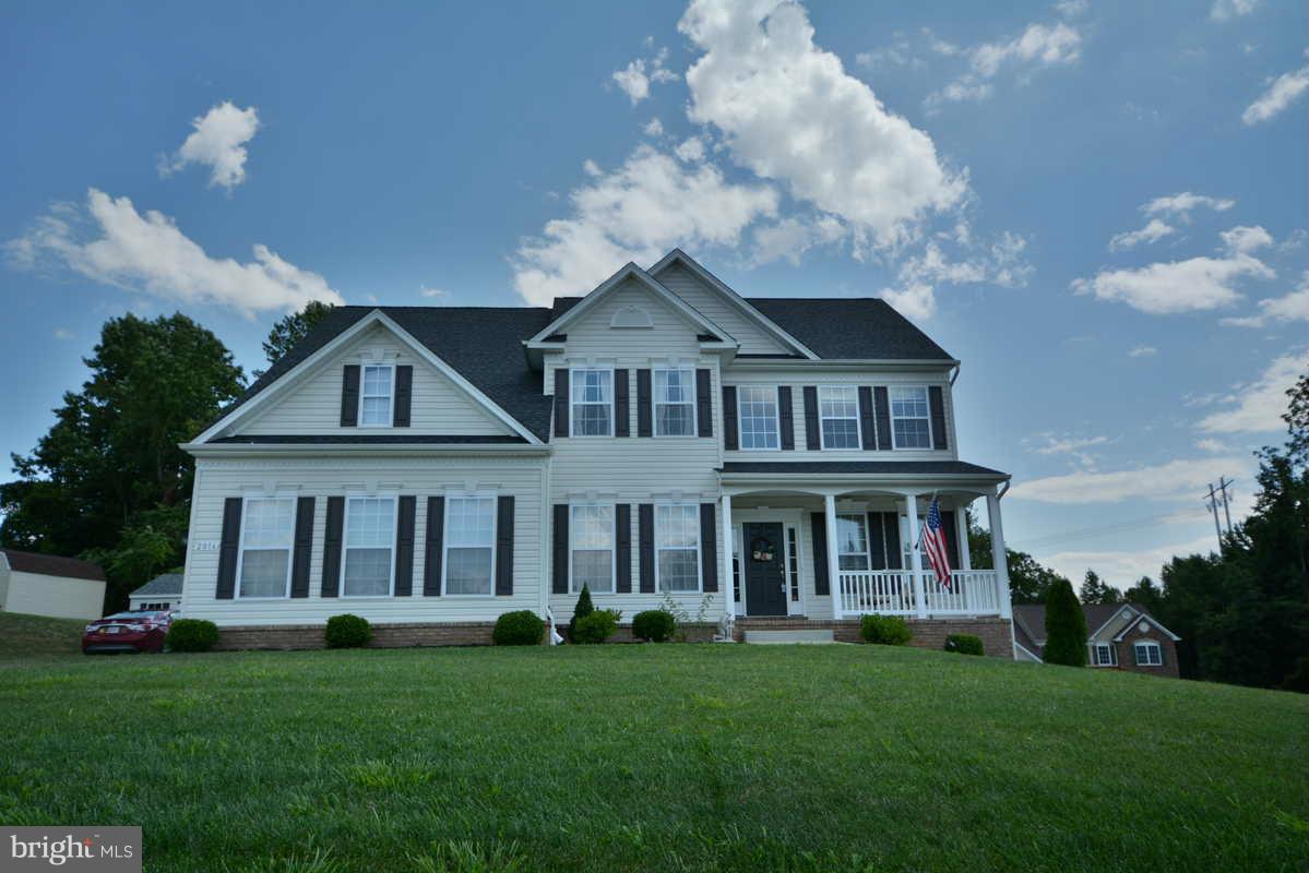 2016 Baythorne Road Prince Frederick, MD 20678 - Photo 1 of 30 a front view of a house with a garden and porch