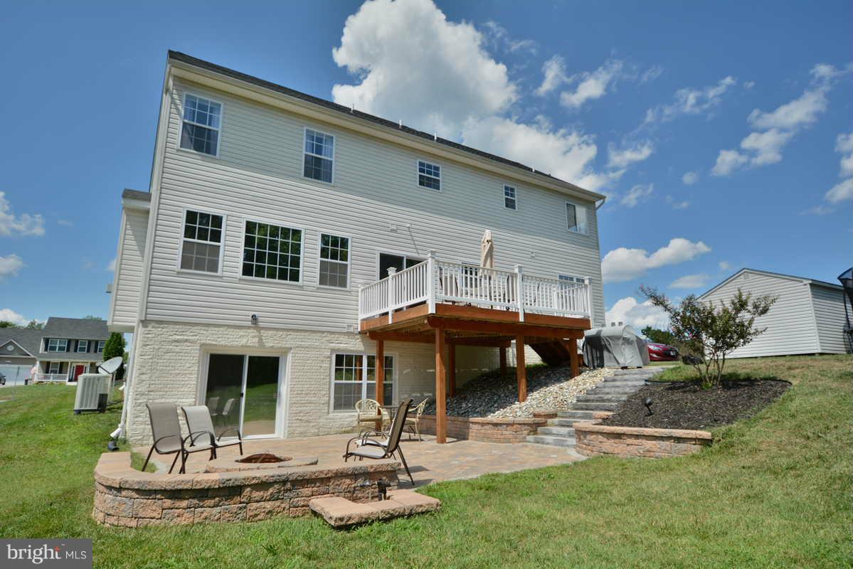 2016 Baythorne Road Prince Frederick, MD 20678 - Photo 2 of 30 a front view of house with yard slide and outdoor seating