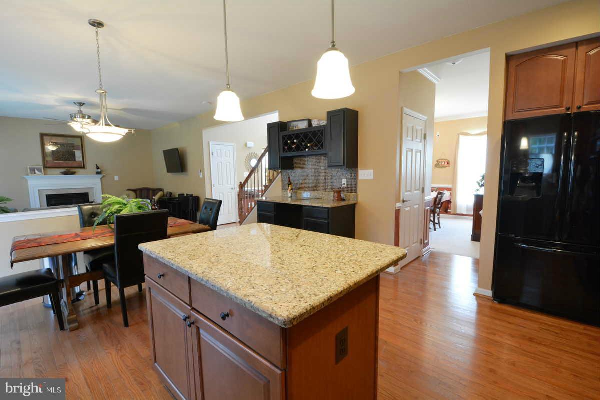 2016 Baythorne Road Prince Frederick, MD 20678 - Photo 13 of 30 a kitchen with a table and chairs in it