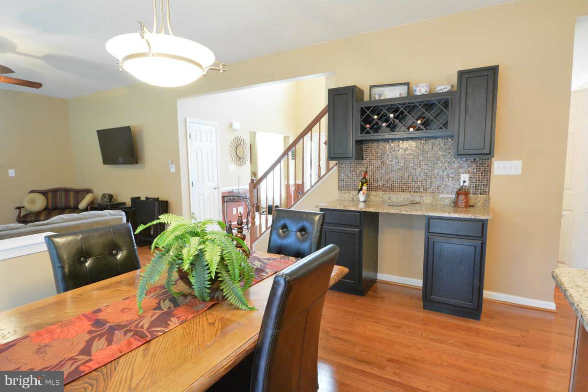 2016 Baythorne Road Prince Frederick, MD 20678 - Photo 15 of 30 a view of a dining room with furniture and wooden floor