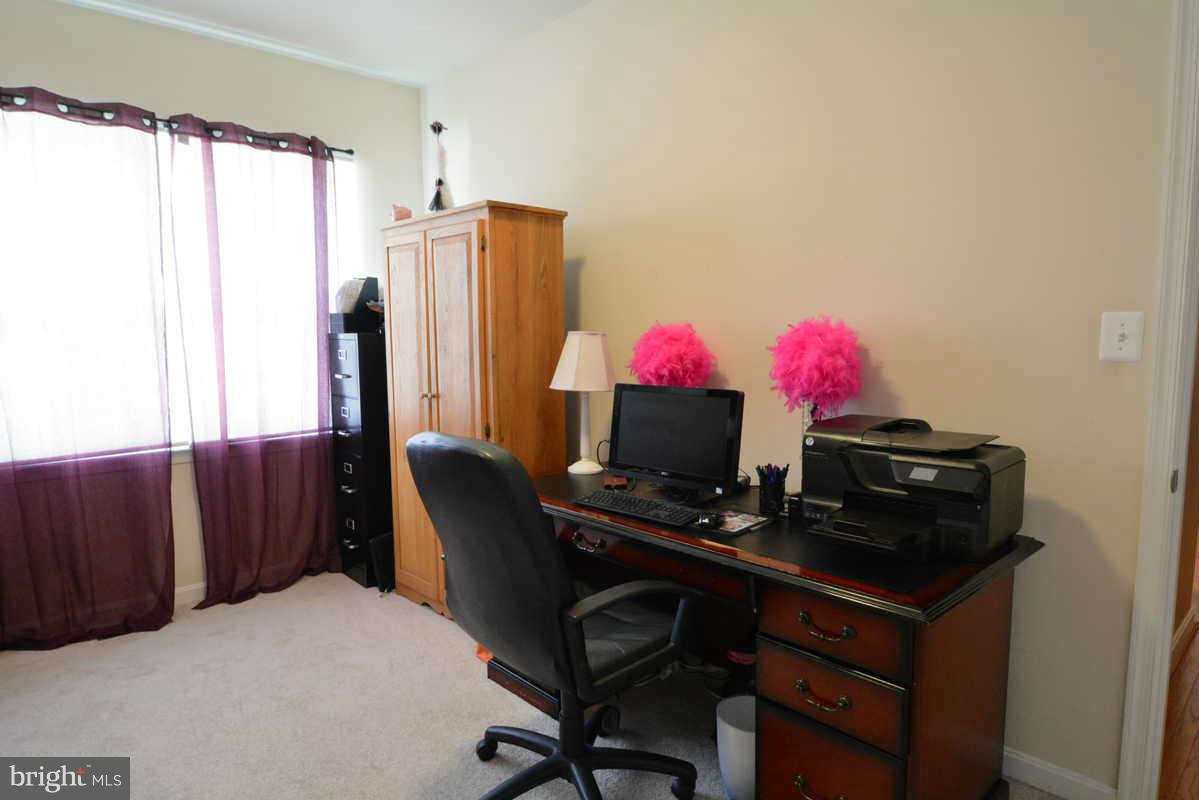 2016 Baythorne Road Prince Frederick, MD 20678 - Photo 17 of 30 a view of a workspace with furniture and a window