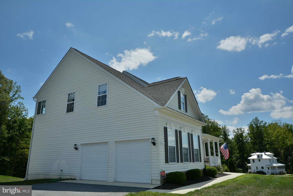 2016 Baythorne Road Prince Frederick, MD 20678 - Photo 3 of 30 a front view of a house with a yard