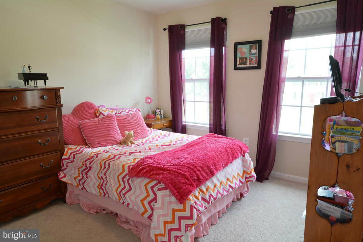 2016 Baythorne Road Prince Frederick, MD 20678 - Photo 21 of 30 a bedroom with a bed and a window