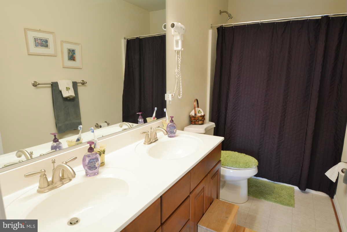 2016 Baythorne Road Prince Frederick, MD 20678 - Photo 22 of 30 a bathroom with a sink and a mirror