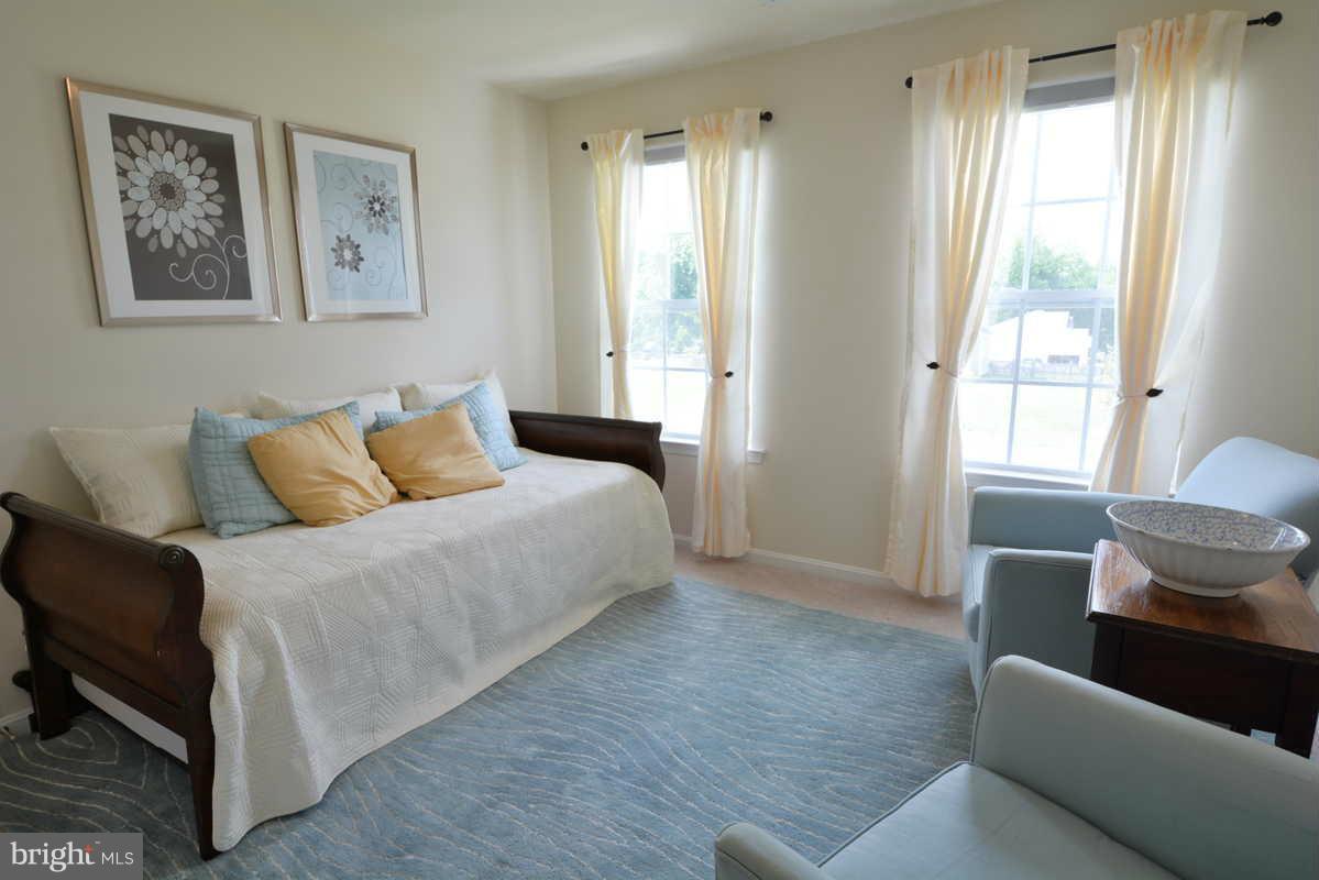 2016 Baythorne Road Prince Frederick, MD 20678 - Photo 23 of 30 a bedroom with a bed and a couch