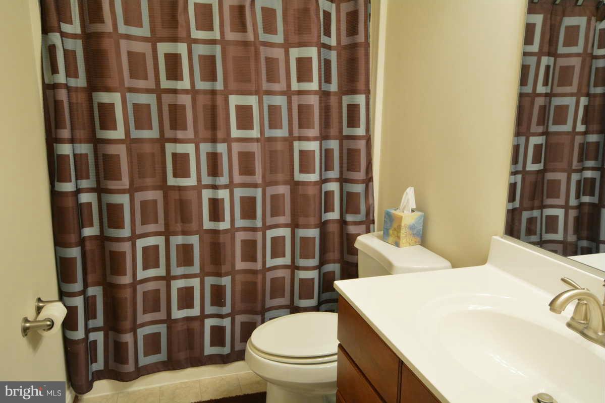 2016 Baythorne Road Prince Frederick, MD 20678 - Photo 24 of 30 a white toilet sitting next to a bathroom sink