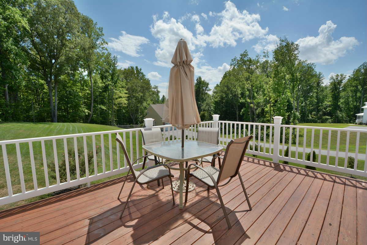 2016 Baythorne Road Prince Frederick, MD 20678 - Photo 5 of 30 a view of a deck with a table and chairs