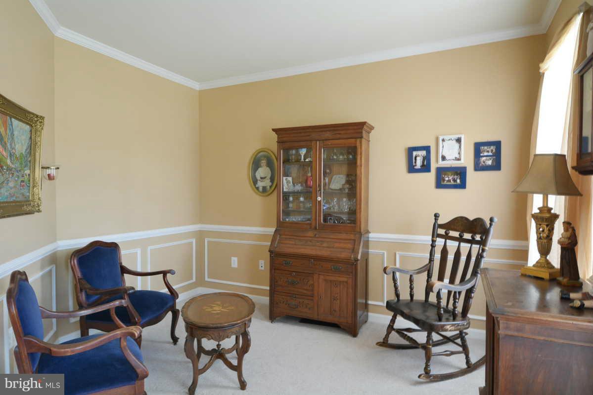 2016 Baythorne Road Prince Frederick, MD 20678 - Photo 10 of 30 a living room with furniture and a chair