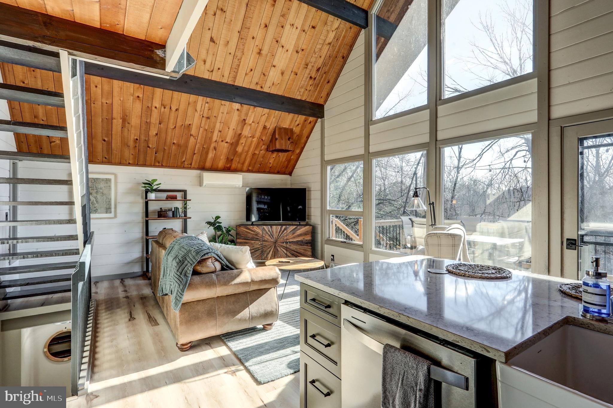 120 Brompton Road Hummelstown, PA 17036 - Photo 31 of 55 a living room with furniture and a floor to ceiling window