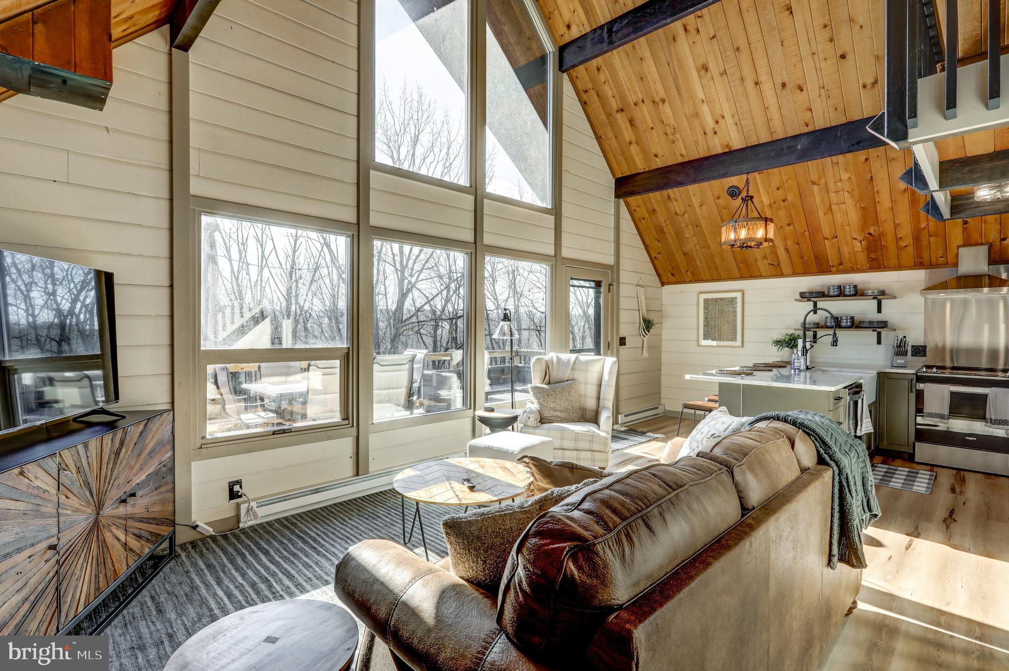 120 Brompton Road Hummelstown, PA 17036 - Photo 37 of 55 a living room with furniture and a floor to ceiling window