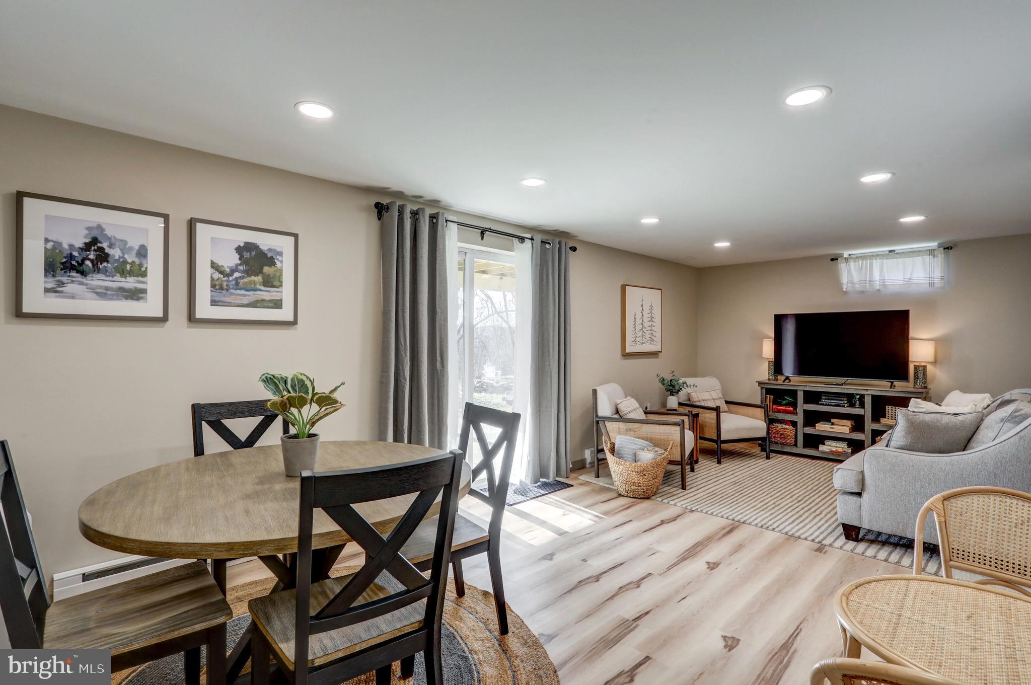 120 Brompton Road Hummelstown, PA 17036 - Photo 45 of 55 a living room with furniture and a flat screen tv