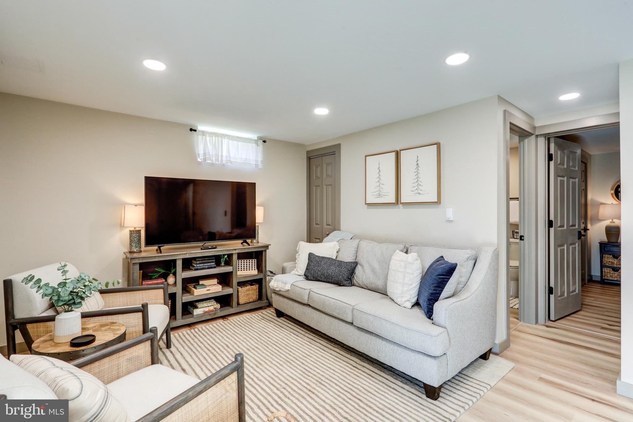 120 Brompton Road Hummelstown, PA 17036 - Photo 47 of 55 a living room with furniture and a flat screen tv