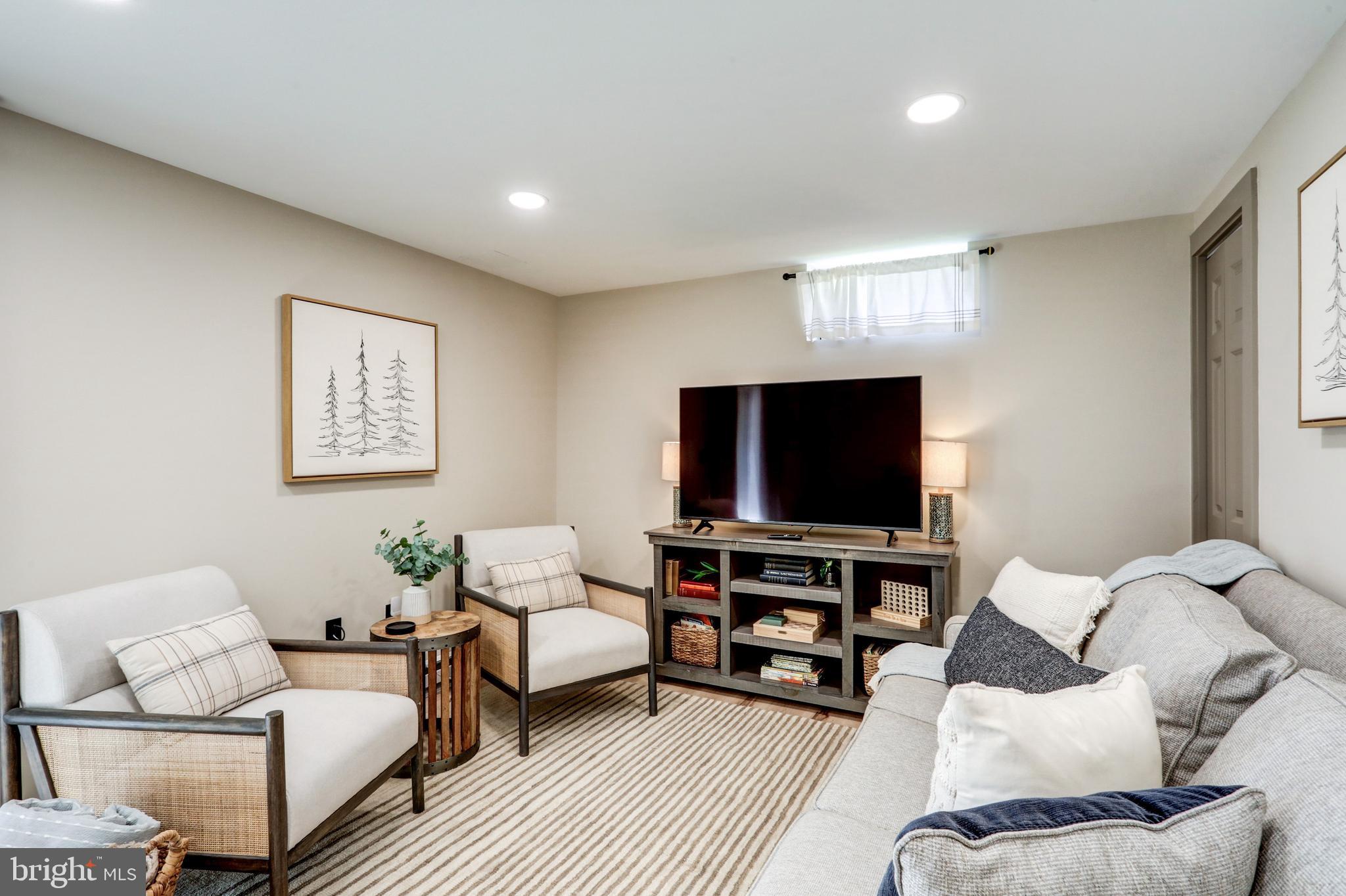 120 Brompton Road Hummelstown, PA 17036 - Photo 48 of 55 a living room with furniture and a flat screen tv