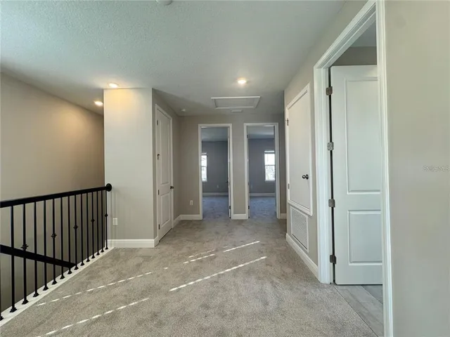 a view of a hallway with closet area