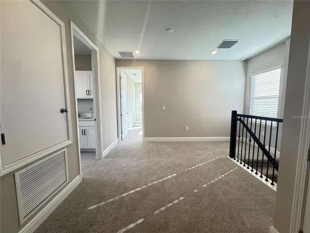 a view of a hallway with closet area