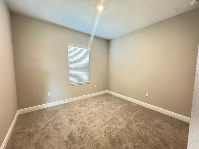 a utility room with sink dryer and washer