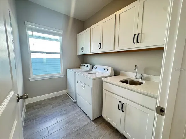 a view of a swimming pool with outdoor seating