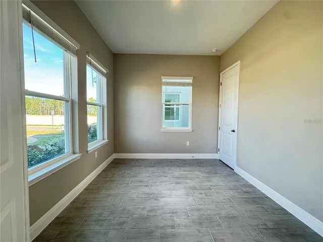 an empty room with windows
