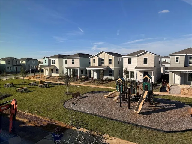 a view of a house with backyard