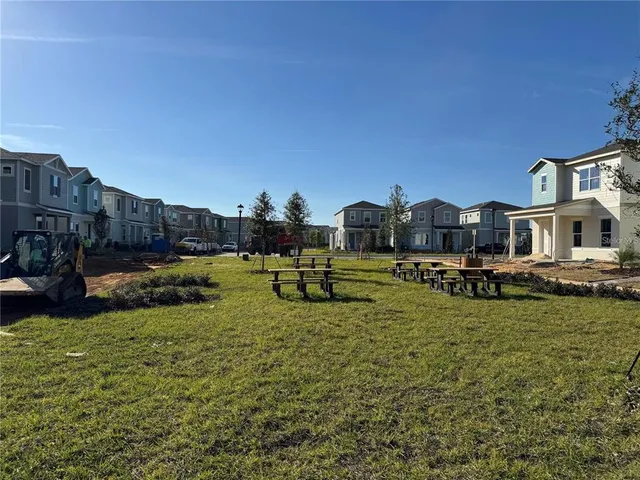 a view of a swimming pool with a bench