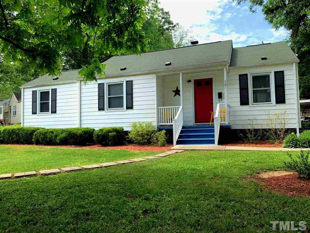 701 North King Charles Road Raleigh, NC 27610 - Photo 1 of 28 a view of a house with backyard and garden