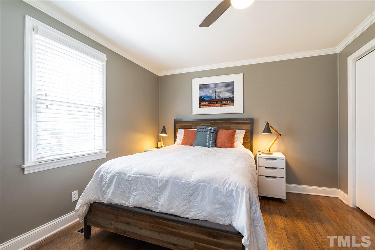 701 North King Charles Road Raleigh, NC 27610 - Photo 18 of 28 a bedroom with a bed and a window