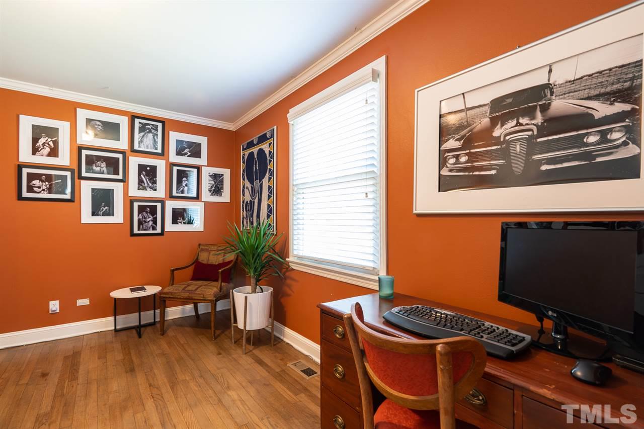 701 North King Charles Road Raleigh, NC 27610 - Photo 23 of 28 a view of a workspace with furniture and a window