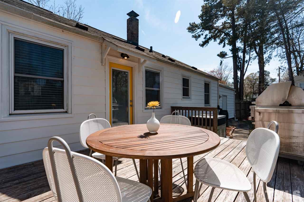 701 North King Charles Road Raleigh, NC 27610 - Photo 28 of 28 a table and chairs in a patio