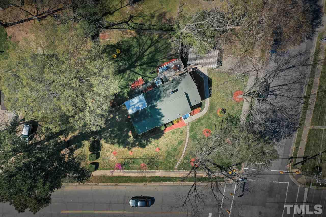 701 North King Charles Road Raleigh, NC 27610 - Photo 5 of 28 an aerial view of a house with a yard and large trees