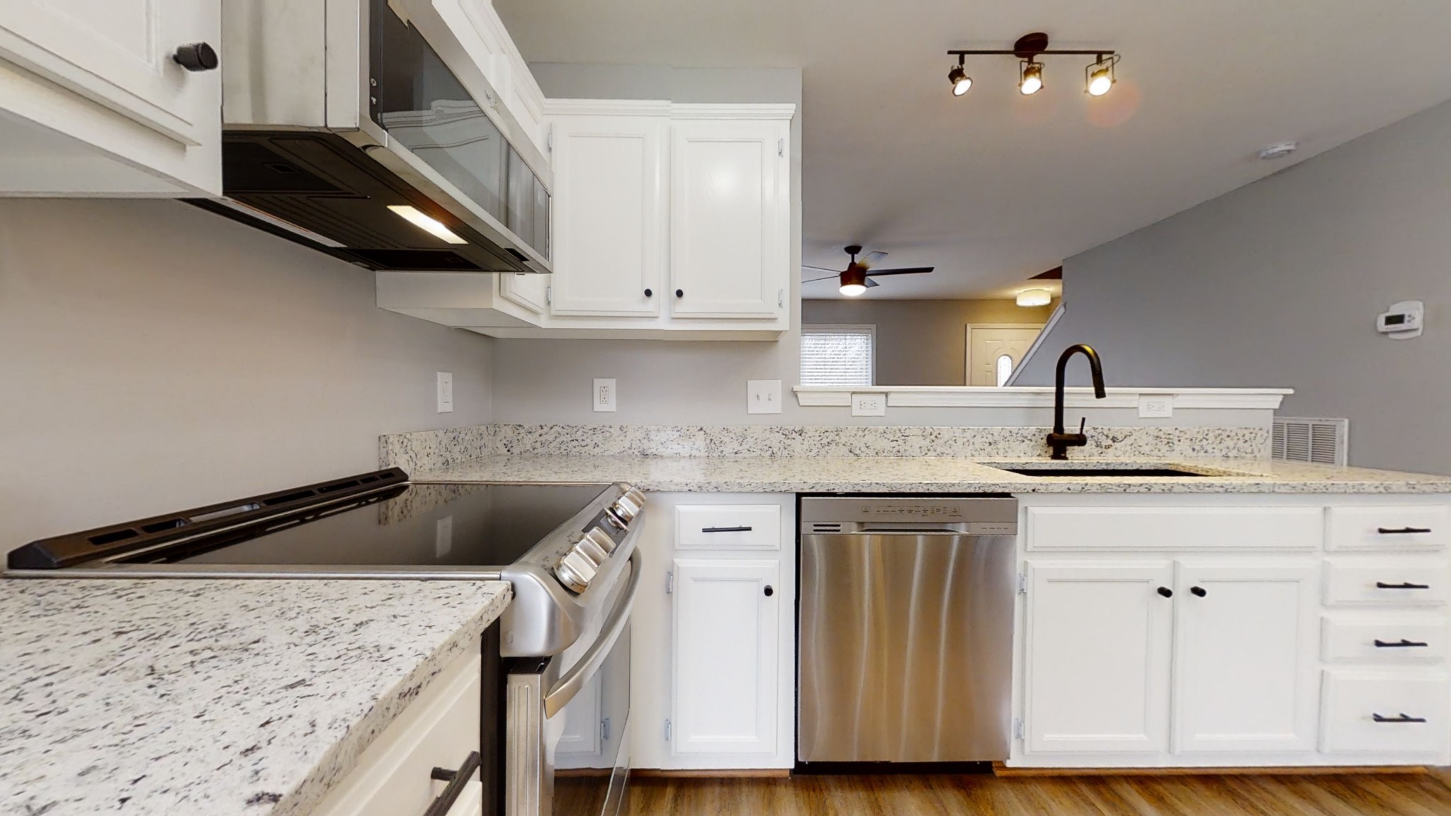 2805 Rippavilla Way Spring Hill, TN 37174 - Photo 11 of 30 a kitchen with a sink a stove and cabinets