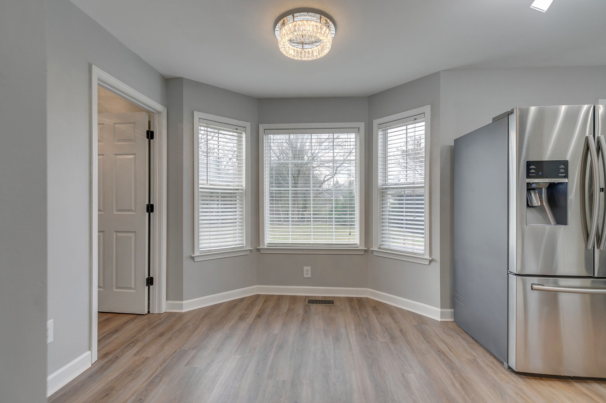 2805 Rippavilla Way Spring Hill, TN 37174 - Photo 13 of 30 a view of an empty room with a window and wooden floor