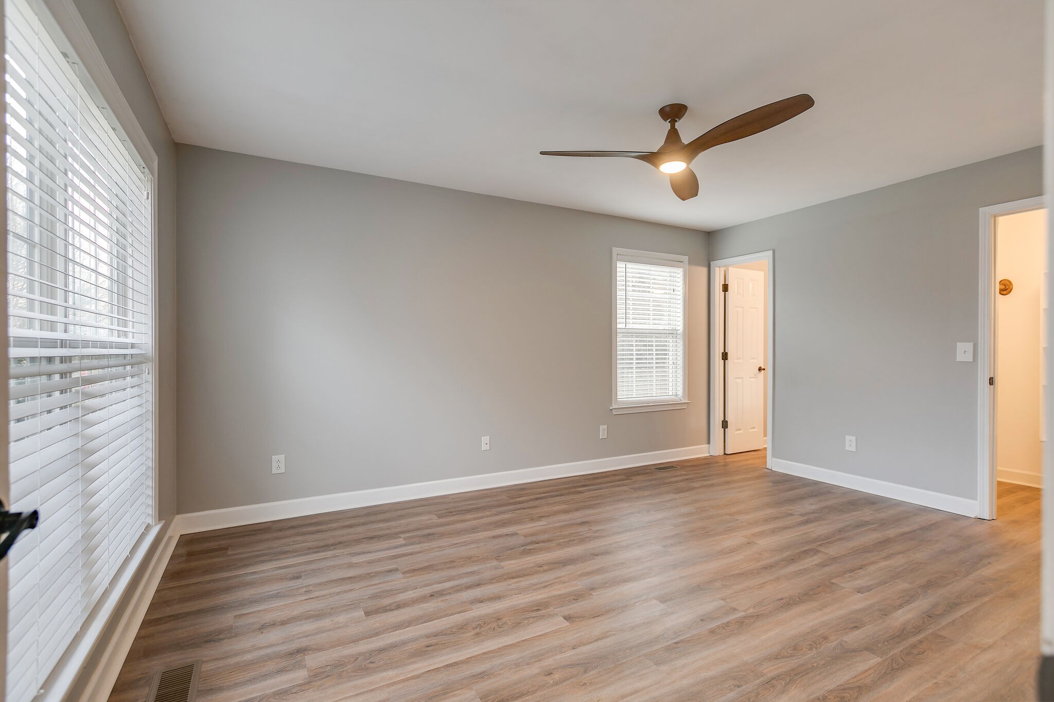 2805 Rippavilla Way Spring Hill, TN 37174 - Photo 15 of 30 a view of an empty room with wooden floor and a window