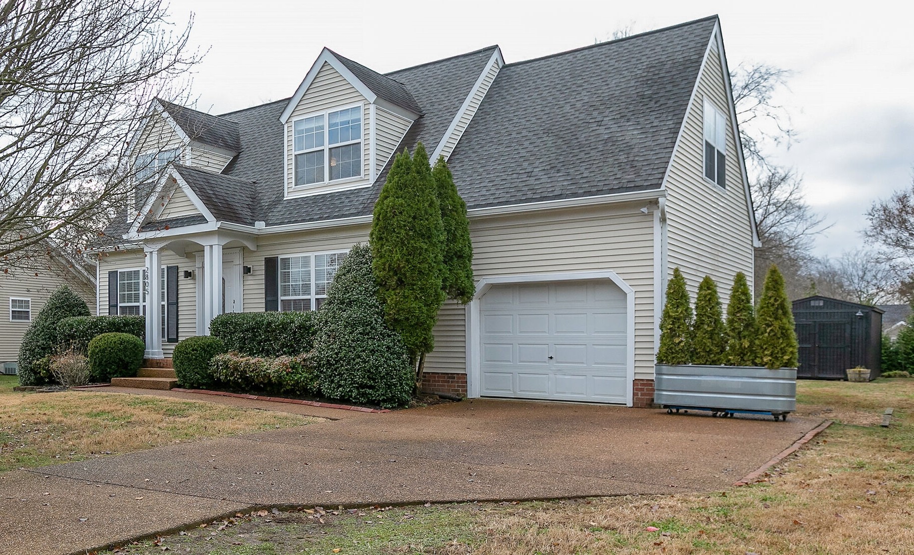 2805 Rippavilla Way Spring Hill, TN 37174 - Photo 4 of 30 a front view of a house with a yard and garage