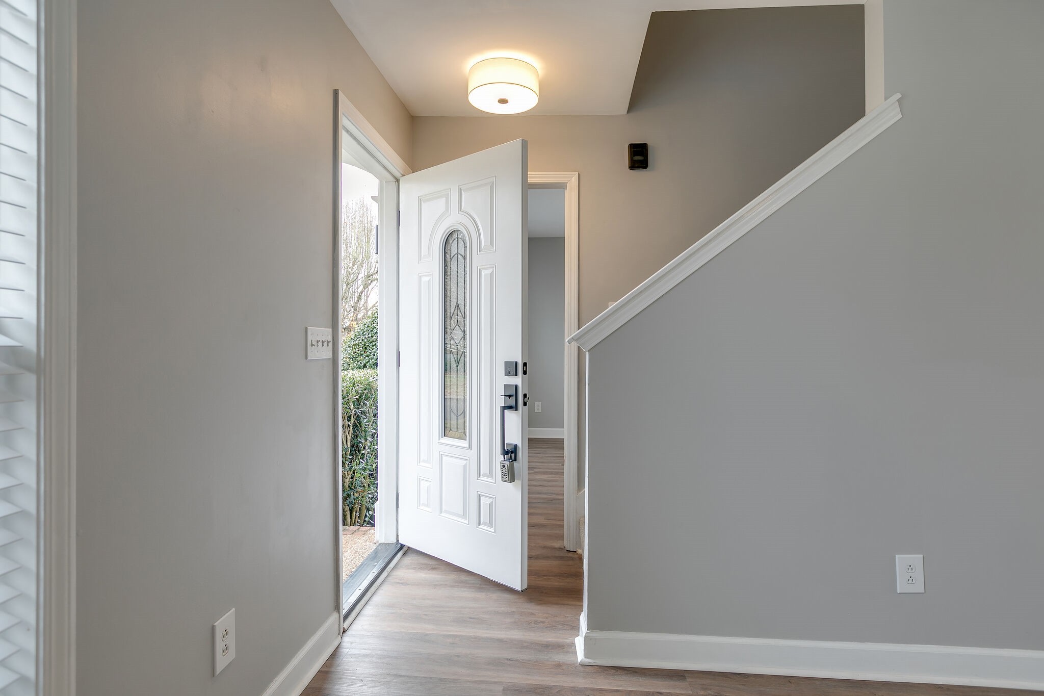 2805 Rippavilla Way Spring Hill, TN 37174 - Photo 5 of 30 a view of a hallway with wooden floor and staircase