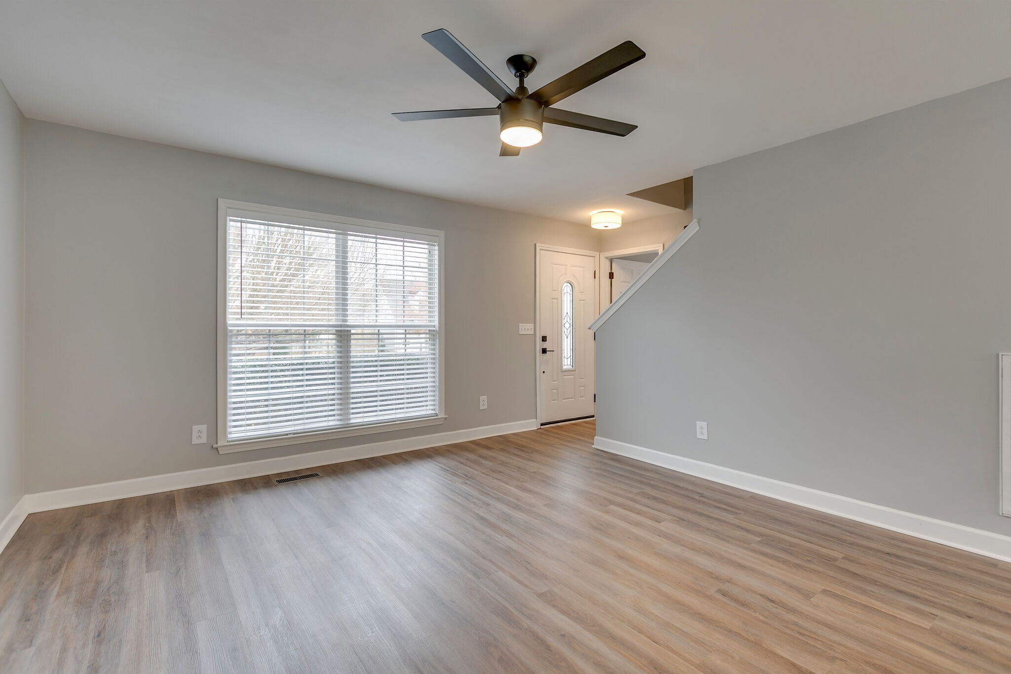2805 Rippavilla Way Spring Hill, TN 37174 - Photo 6 of 30 an empty room with wooden floor and windows