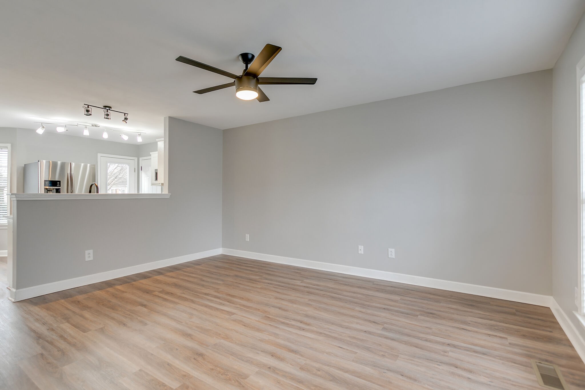 2805 Rippavilla Way Spring Hill, TN 37174 - Photo 8 of 30 wooden floor in an empty room with a window
