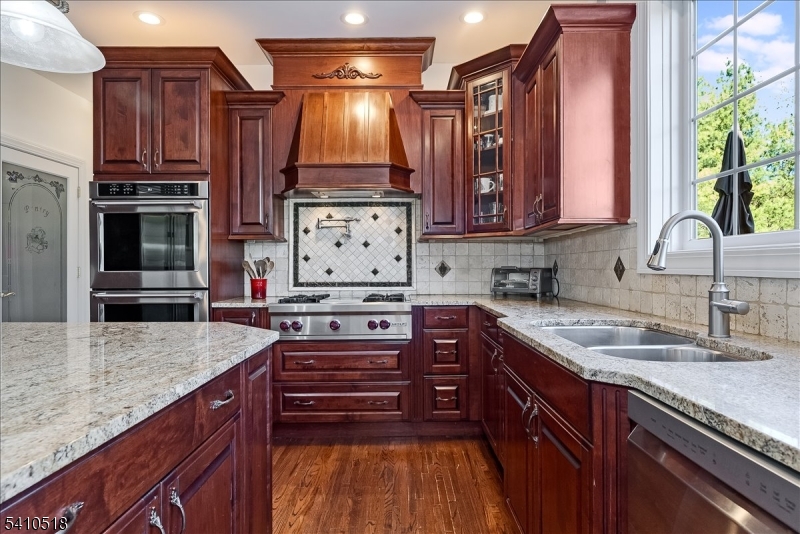 1 Brodziak Road Denville, NJ 07834 - Photo 12 of 42 a kitchen with stainless steel appliances granite countertop a stove a sink and a microwave