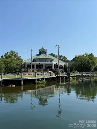 a view of a lake with houses in the back