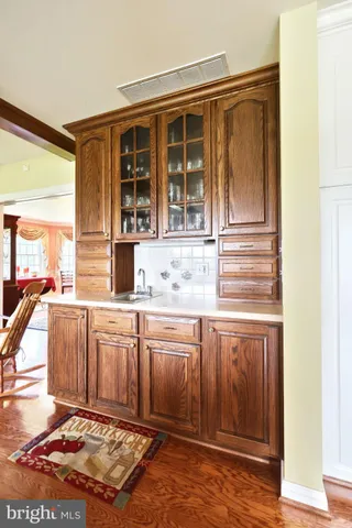 a spacious bathroom with a double vanity sink toilet and a mirror