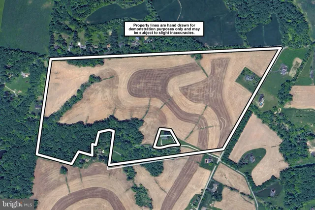 an aerial view of a house with outdoor space